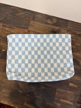 Load image into Gallery viewer, Blue and white checkered cosmetic pouch on a wooden surface
