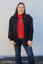 Load image into Gallery viewer, Woman wearing a black lace shacket, red ss mock sweater, and blue jeans standing against a white brick wall.