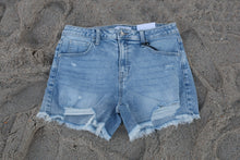 Load image into Gallery viewer, Blue denim shorts on a sandy surface