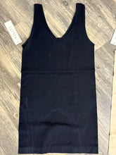 Load image into Gallery viewer, Black tank top on a wooden surface with a visible tag.
