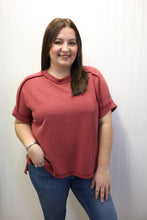 Load image into Gallery viewer, Woman wearing a red ribbed top and blue jeans on a white background