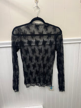 Load image into Gallery viewer, Black lace long-sleeve top on a hanger against a white wall
