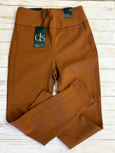 Load image into Gallery viewer, Folded rust pants with a brand tag on a light wooden surface