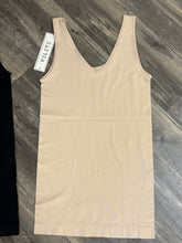 Load image into Gallery viewer, Beige tank top with a tag on a wooden surface