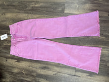 Load image into Gallery viewer, Pink jeans with a tag on a wooden surface