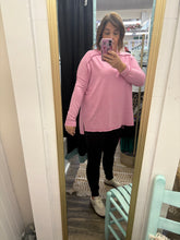 Load image into Gallery viewer, Woman wearing a long sleeve top and black pants standing in front of a mirror.