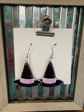 Load image into Gallery viewer, Black and purple witch hat earrings on a white card with a rustic metal background