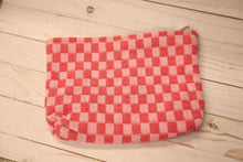 Load image into Gallery viewer, dark pink and light pink checkered pouch on a wooden surface