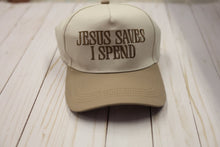 Load image into Gallery viewer, Beige cap with 'Jesus Saves I Spend' text on a wooden surface