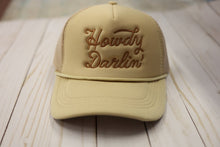 Load image into Gallery viewer, Beige cap with 'Howdy Darlin' text on a wooden surface