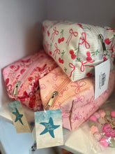 Load image into Gallery viewer,  fabric cosmetic pouches with cherry , cowboy print and bow pattern on a white background
