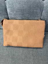 Load image into Gallery viewer, Brown textured clutch bag on a gray surface
