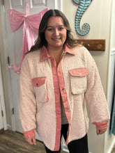 Load image into Gallery viewer, Woman wearing a pink sherpa textured jacket in a room.
