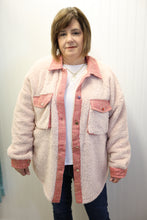 Load image into Gallery viewer, woman wearing a pink sherpa jacket on a plain background
